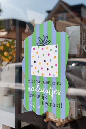 'Hier worden jouw cadeautjes feestelijk ingepakt' Raamsticke